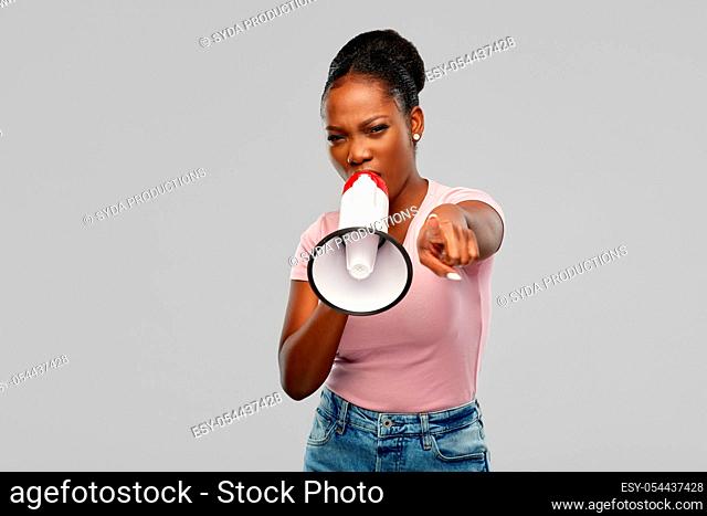 angry african american woman over grey background