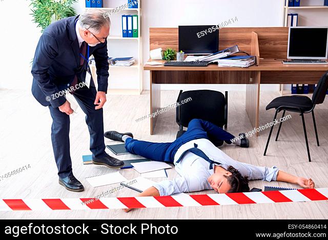 Forensic investigator and dead employee in the office