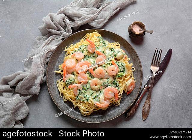Italian Spaghetti or Pasta with shrimps, garlic and herbs in a creamy Alfredo sauce. Keto diet food concept