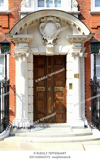 Luxury wooden door to apartment, London, UK