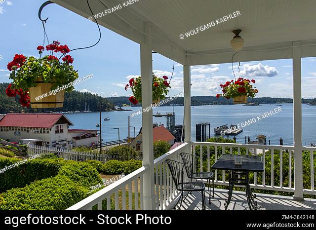 View of the Orcas Island Ferry Landing from the Orcas Hotel, a historic inn and cafe built 1904, in Orcas Village on Orcas Island in the San Juan Islands in...