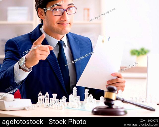 Young lawyer playing chess to train his court strategy and tactics