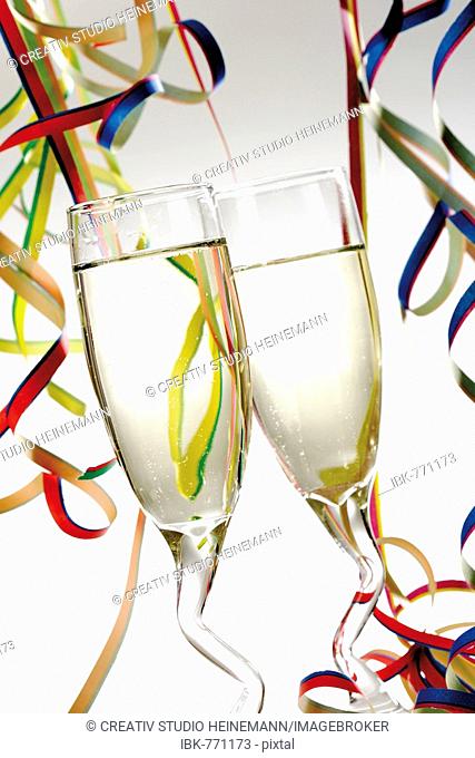 Two champagne glasses with paper streamers