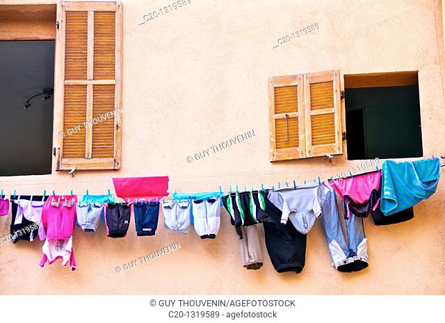 Windows with hanging colored washing. Le Panier Quarter, Marseille, Bouches du Rhone, 13, France