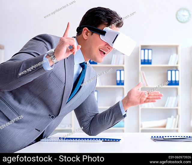 The businessman with virtual reality glasses in the office