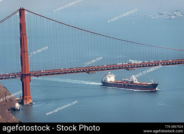 Freighter under the Golden Gate Bridge, San Francisco, California, U. S. A