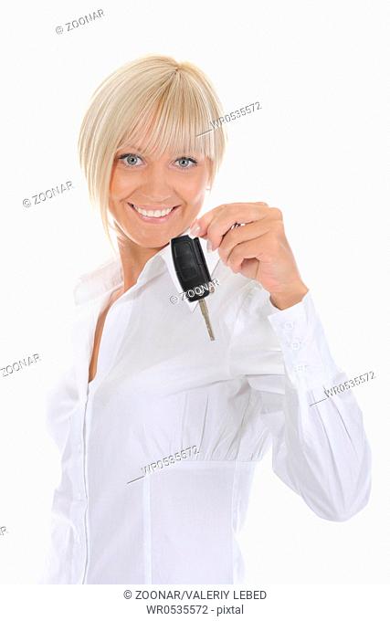 woman holds the key to the car