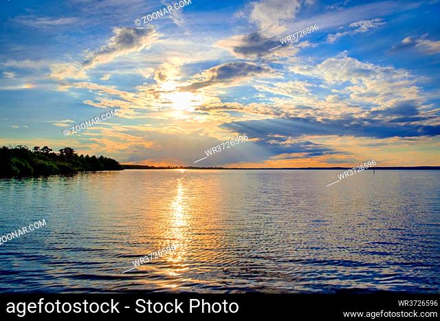 Beautiful romantic colorful sunset over a calm lake