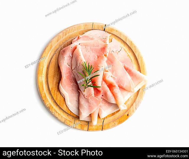 Sliced pork ham on cutting board isolated on white background