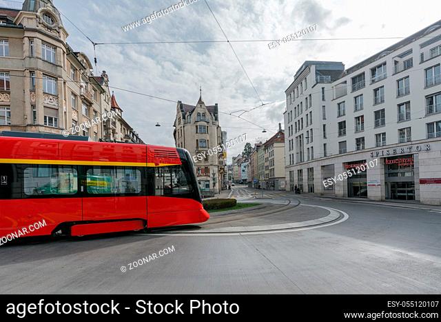 St. Gallen, SG / Switzerland - April 8, 2019: the historic Appenzeller train rounds the Spisertor in downtown St. Gallen on ist way out of the city