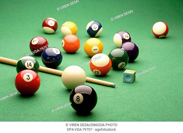 Snooker, pool balls with cue on snooker table