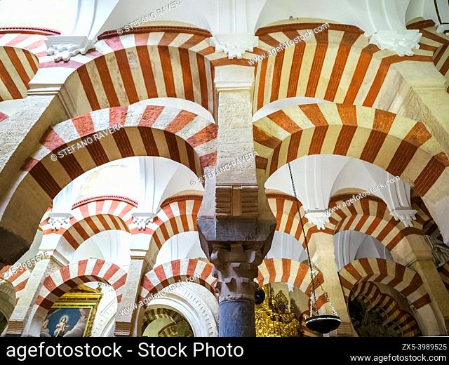 Decorated archways and columns in Moorish style in the Mezquita-Catedral (Great Mosque of Cordoba) - Cordoba, Spain