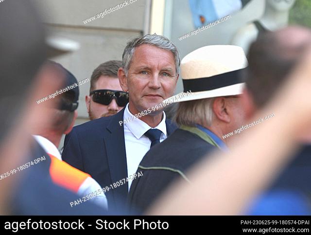 25 June 2023, Bavaria, Würzburg: Björn Höcke, chairman of the AfD Thuringia, stands near a memorial stele commemorating the victims of a knife attack in 2021