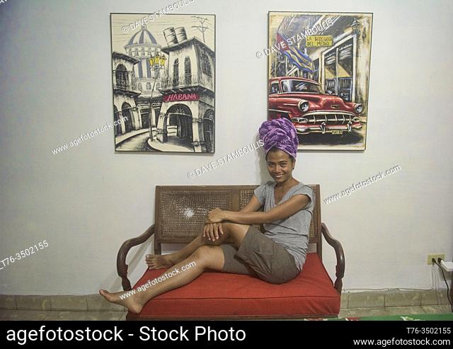 Relaxing in front of El Bodeguito paintings, Havana, Cuba