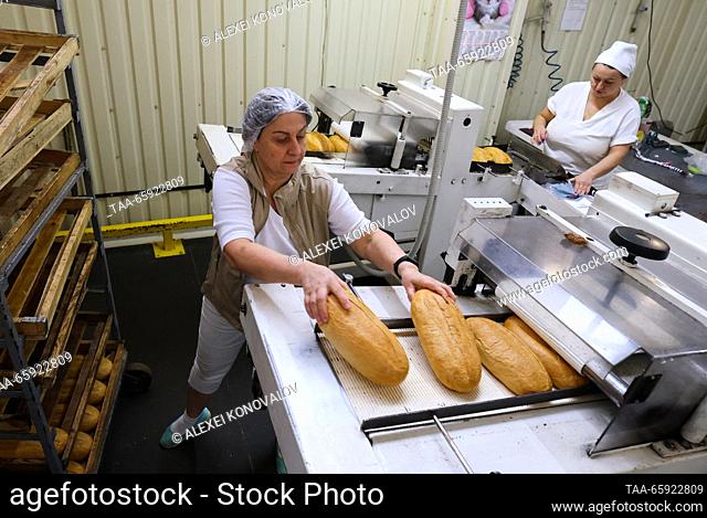 RUSSIA, ZAPOROZHYE REGION - DECEMBER 19, 2023: Employees are at work at a packaging line of the Berdyansk Bakery in the city of Berdyansk