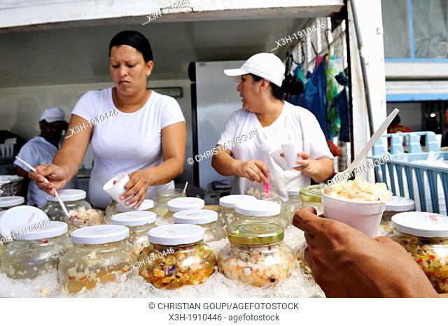 tasting of Ceviche, a popular dish made from fresh raw seafood marinated served with ice, fish and seafood market of San Felipe area, Panama City