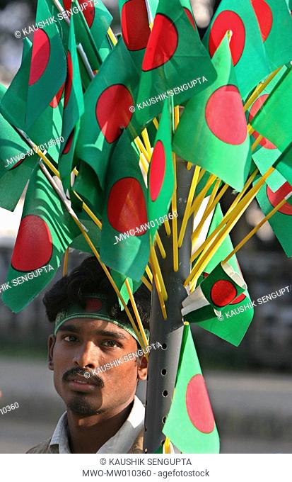 A vendor sells National flag during 'Victory Day' celebrations at the National Memorial in Saver on the outskirts of Dhaka, Bangladesh December 16, 2007