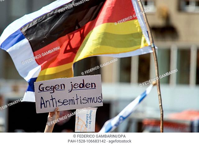 19 July 2018, Germany, Bonn: A demonstrator holding a sign with the words 'Gegen jeden Antisemitismus' (lit. against all anti-semitism) in front of a...