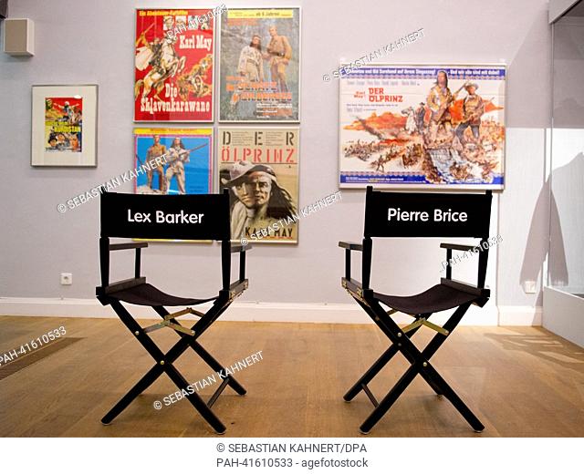 Two director's chairs sit in front of historic film posters in the exhibition ""Mit Karl May um die Welt"" (With Karl May around the World) at the Wilhelm Busch...