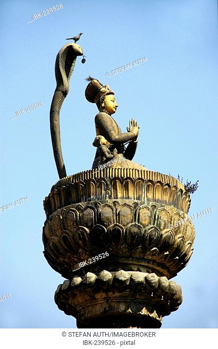 Statue of king Yoganarendra Malla with snake and bird Patan Kathmandu Nepal