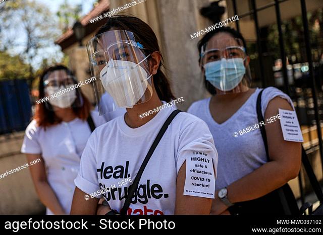Healthcare workers call for a free, safer and effective COVID-19 vaccine during a protest outside the Philippine General Hospital in Manila