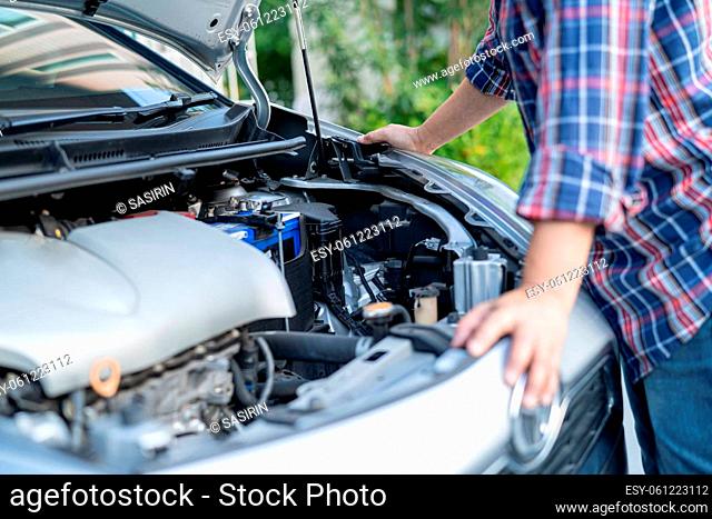 Open hood mechanic engine system to check and repair damage car crash