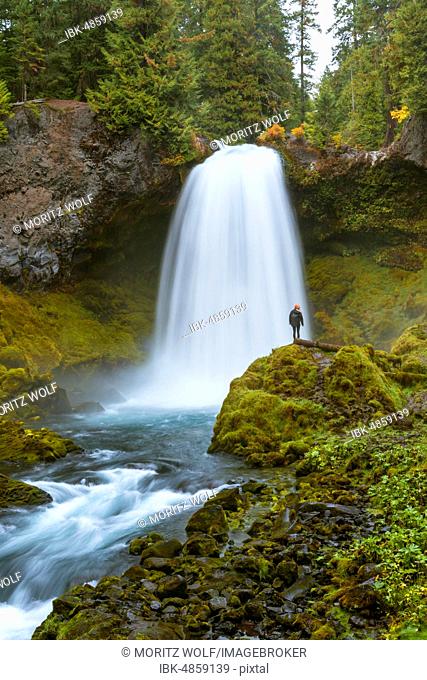 Person in front of a waterfall, Sahalie Falls, Oregon, USA