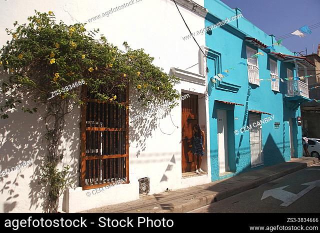 Woman at the entrance of a colonial building at the historic center, Cartagena de Indias, Bolivar, Colombia, South America