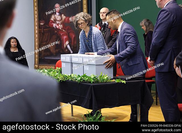 26 May 2023, Baden-Württemberg, Mannheim: The mummified heads are placed on a table in gray boxes as part of a procession for the handover ceremony