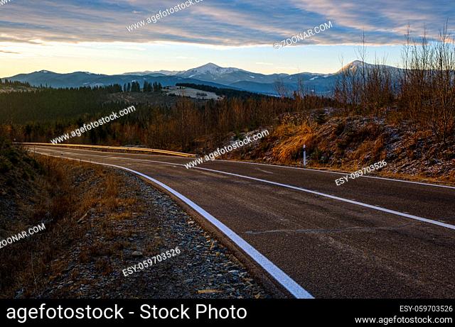 Asphalt road curve and autumn sunset Mountains, Ukraine, Carpathian