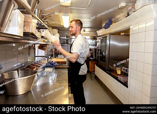 Man working in restaurant kitchen