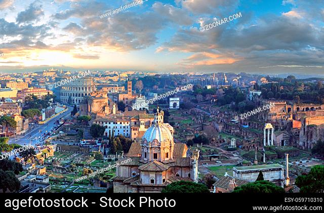 Ruins of Roman Forum. Rome City evening view from II Vittoriano top. People are unrecognizable. Two shots stitch panorama
