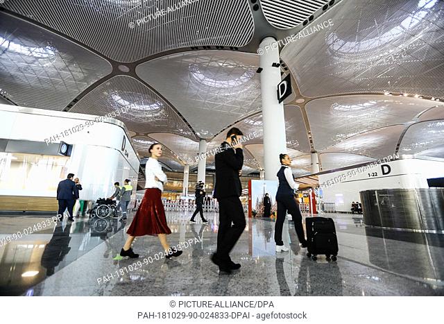 29 October 2018, Turkey, Istanbul: People walk in the new Istanbul International Airport during it's opening ceremony. The airport is estimated to become one of...