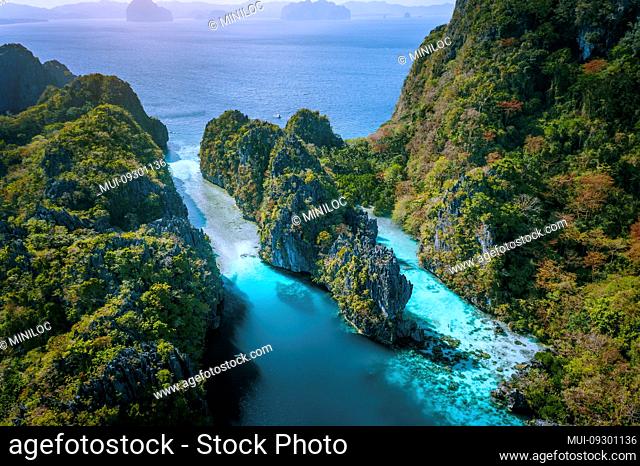 Aerial drone view of entrance to Big and Small Lagoon surrounded by steep cliffs El Nido, Palawan Philippines
