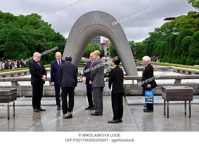 Czech Prime Minister Bohuslav Sobotka (second from left) and Czech Culture Minister Daniel Herman (left) laid a wreath in the Peace Memorial Park in Hiroshima...