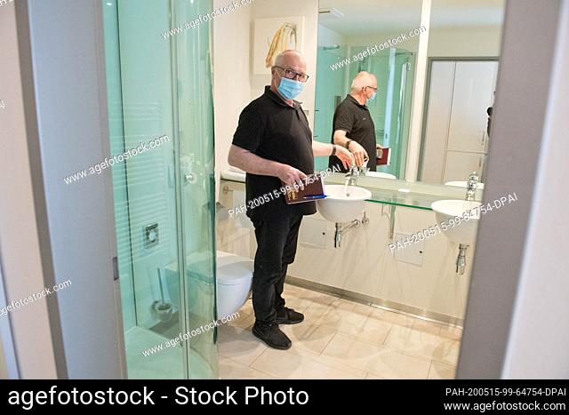 13 May 2020, Mecklenburg-Western Pomerania, Binz: Housekeeper Waldfried Breithaupt walks through the rooms every day, airing and operating taps and flushes to...