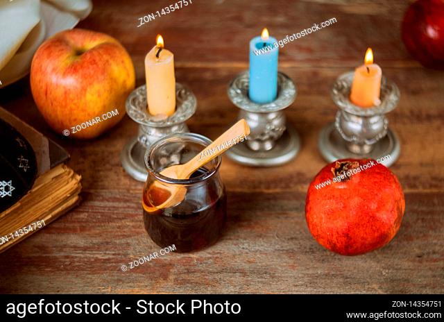Apple and honey, traditional kosher food of jewish New Year Rosh Hashana talit and shofar