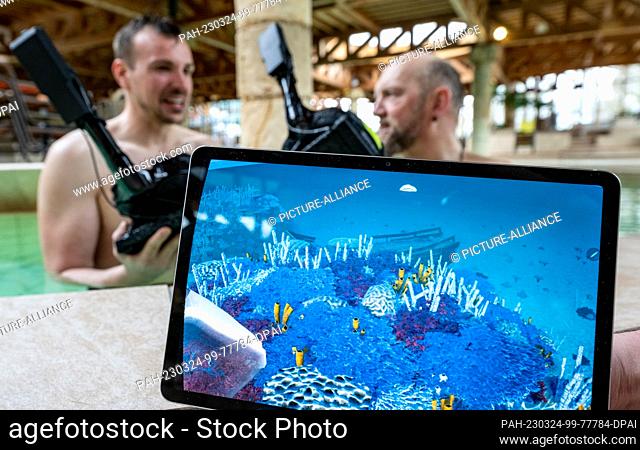 24 March 2023, Saxony-Anhalt, Halle (Saale): The coral world as seen through underwater VR goggles is shown on a display at the Maya mare swimming paradise in...