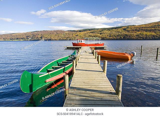 Boats moored on Coniston Water in the Lake District UK