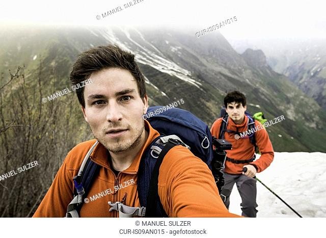 Self portrait of two brothers mountain trekking, Bavarian Alps, Oberstdorf, Bavaria, Germany