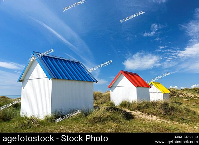 colorful beach huts in the dunes of Gouville-sur-Mer, France, Normandy, Department Manche