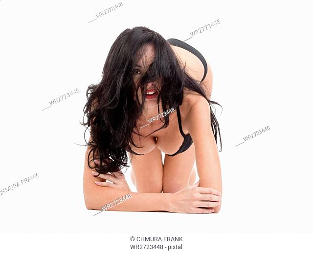 beautiful woman in black underwear looking at camera - isolated on white