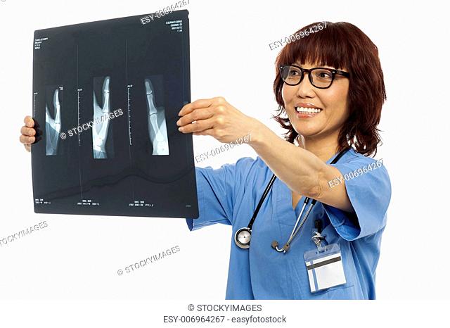 Female doctor reviewing x-ray report of her patient. Indoor shot