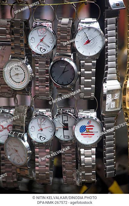 Wrist watches hang outside of shop for sell, Pune, Maharashtra, India, Asia