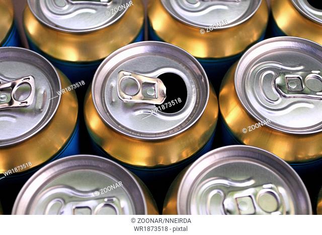 Much of yellow drinking cans close up