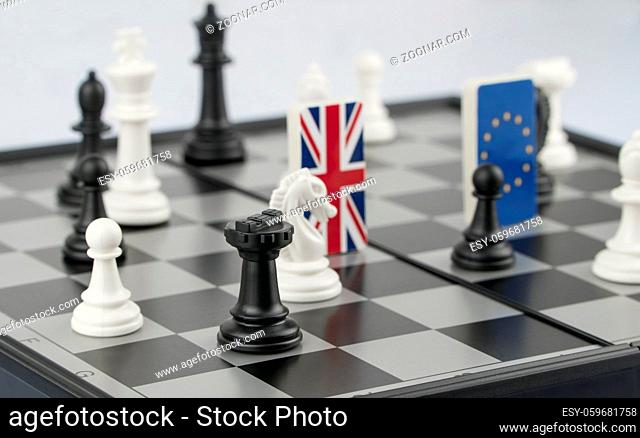 Chess pieces and flags of the European Union and the UK on a chessboard. The concept of the political game and chess strategy Brexit