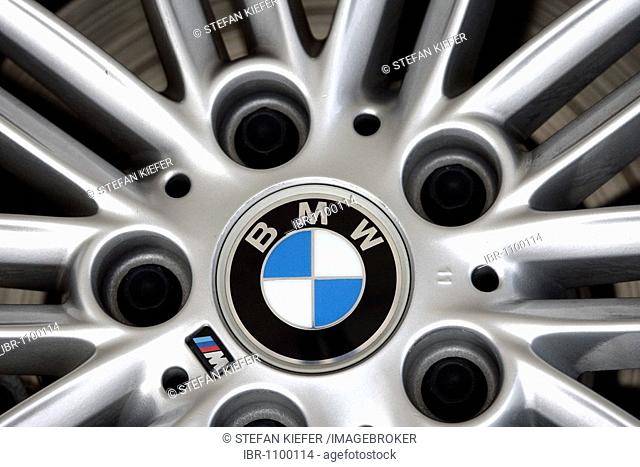 Aluminium wheel rim of a BMW 3 with company logo