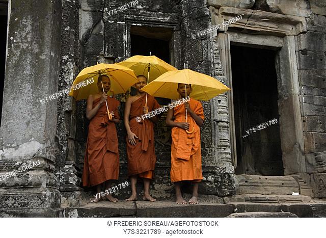 Buddhist monks at Bayon temple, Angkor Thom, Siem Reap, Cambodia, South east Asia