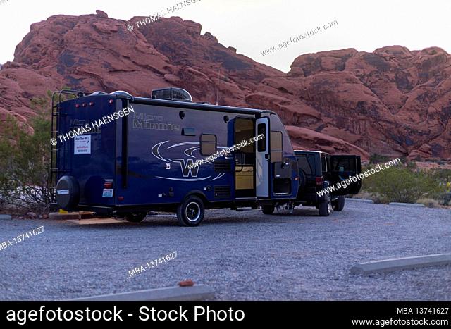 Jeep and Trailer in Front of red rocks in Valley of Fire State Park, Nevada, USA