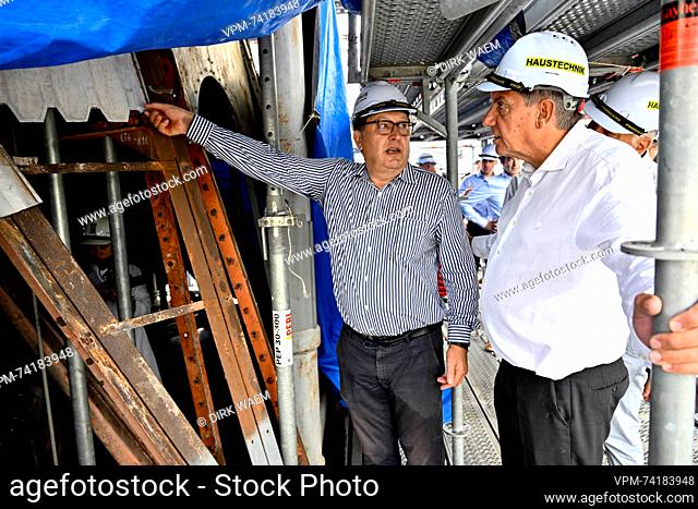 Flemish Minister President Jan Jambon speaks to a site manager of Group Monument during a visit of the Notre-Dame Cathedral of Saigon in the marge of a trade...